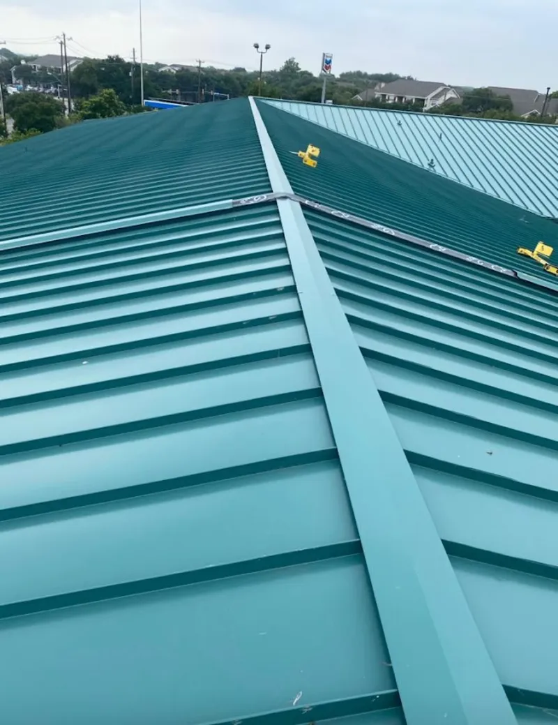 Green commercial metal roof ridge and valley for Metal Roof Repair in Nuevo
